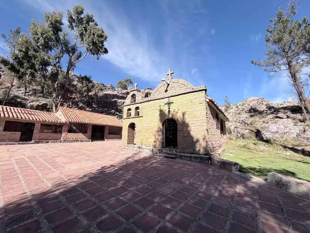 The Chataquila chapel with a tiled forecourt under a blue sky