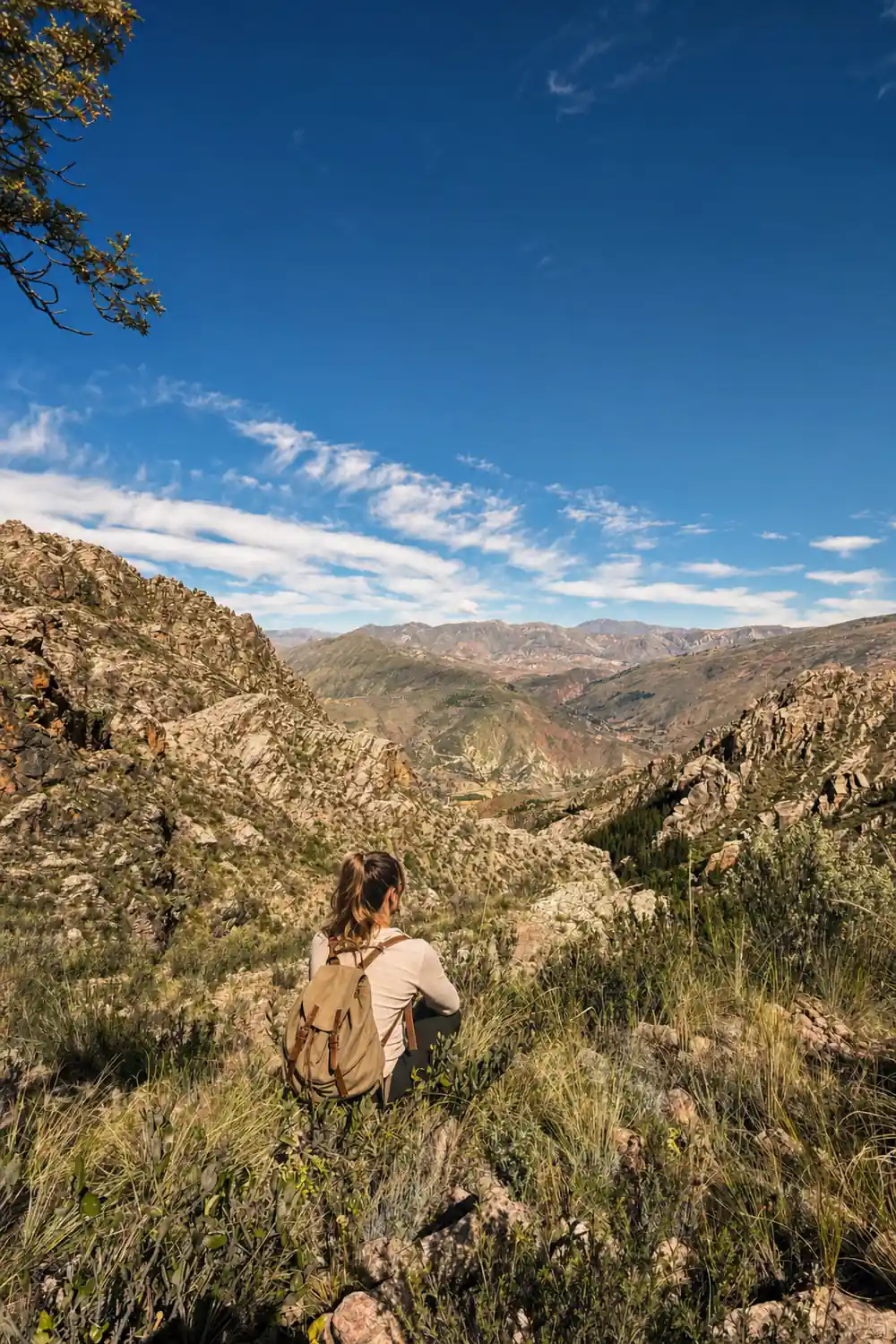 A green valley between rocky ridges under a blue sky
