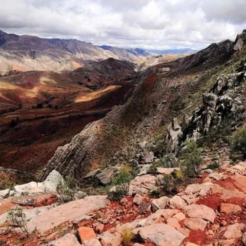 A red stone path winding down into the valleys near Maragua