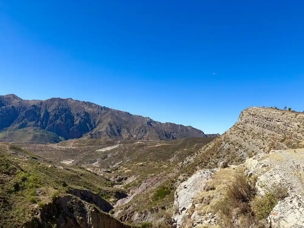 A rocky valley opening between steep hillsides